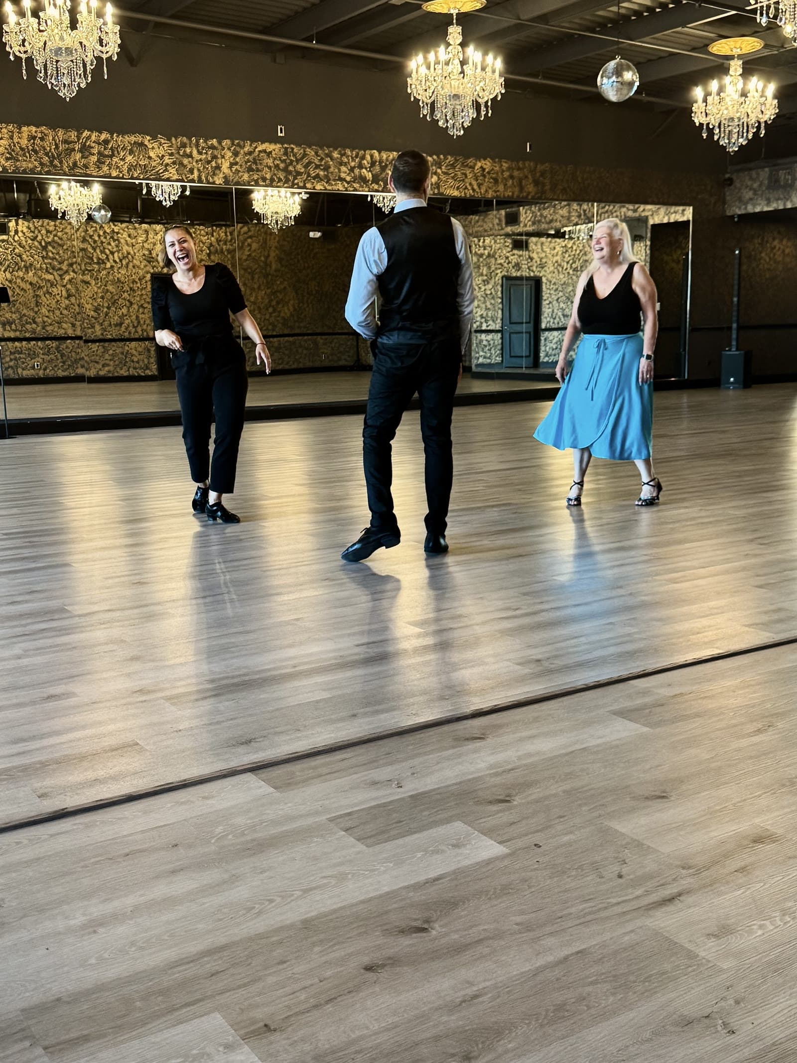 Students dancing together during a lesson at Dance Journey Studios