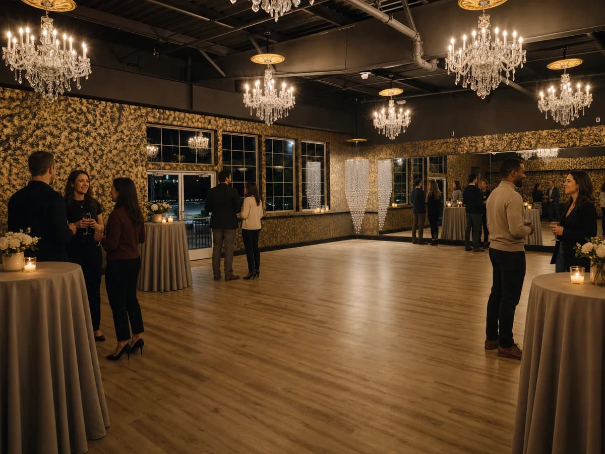 The ballroom arranged for a private event with cocktail tables and ambient lighting