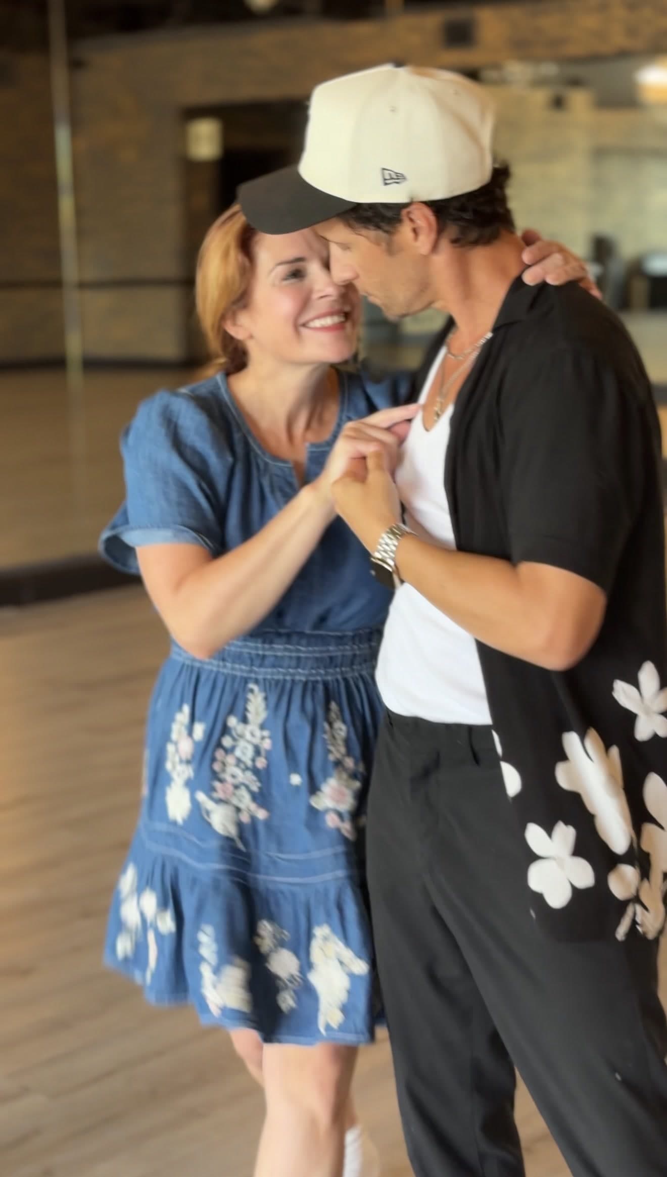 A couple dancing close together during a wedding dance lesson at Dance Journey Studios in Katy, TX